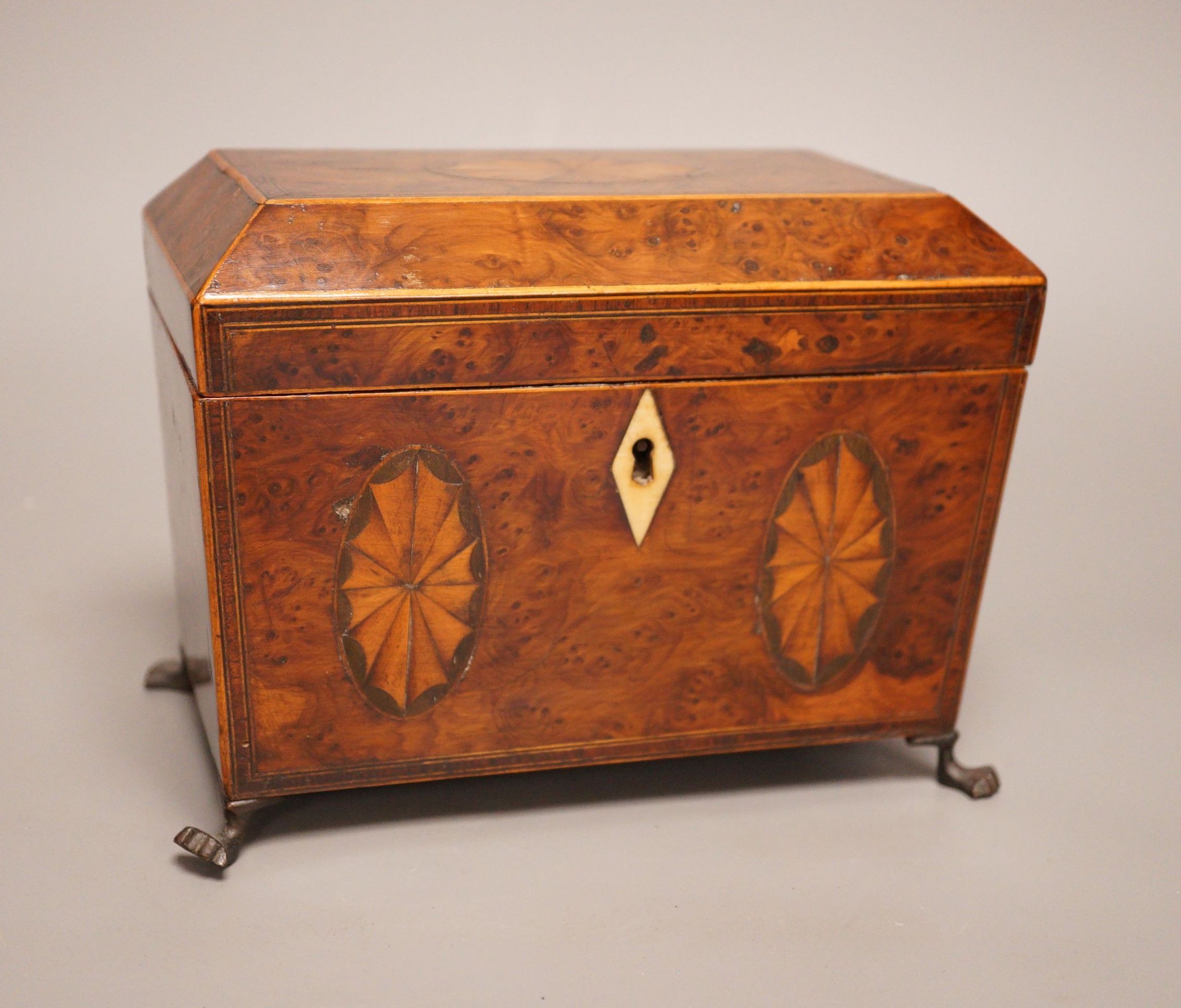 A Regency inlaid burr yew tea caddy, ivory escutcheon, 19cm foot to foot